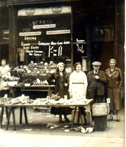 Photo of Susan Ostrov's maternal grandfather in front of his vegetable store